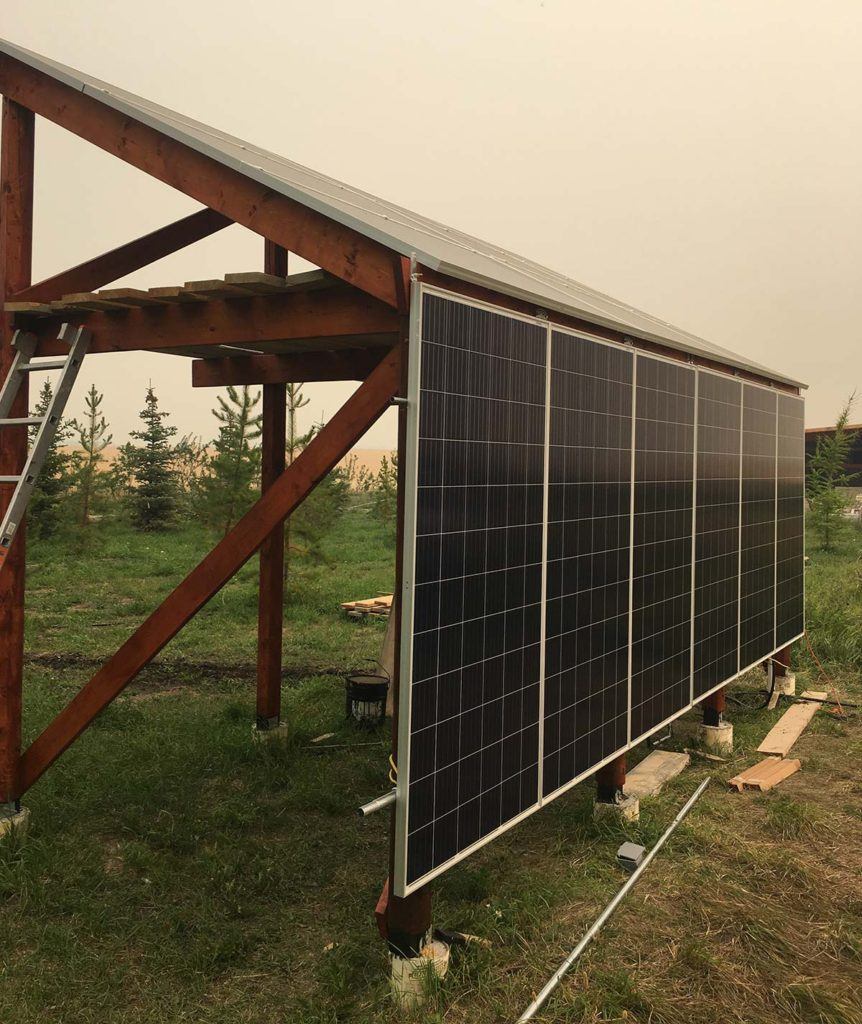 solar panels installed on an outdoor wood structure