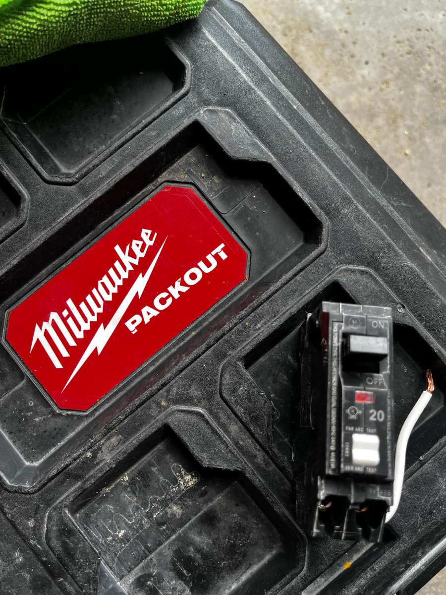 a black box with a red milwaukee sticker to check for arc faults