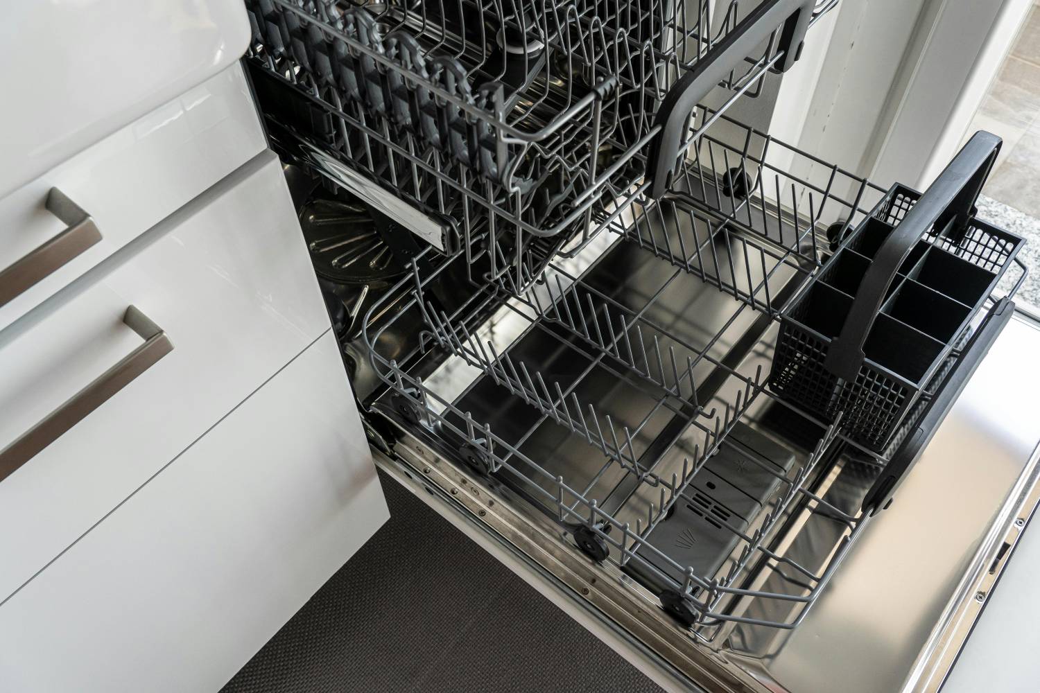 an empty, open dishwasher