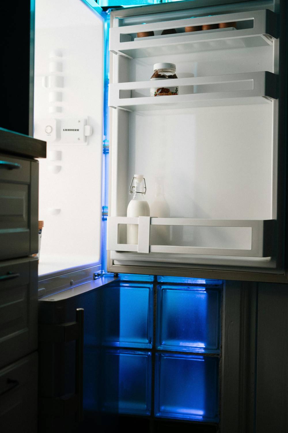 an open refrigerator in a dark room